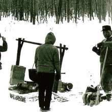 Seneca Indians demonstrating technique used in winter fish drives.