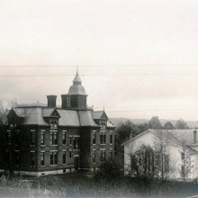Cattaraugus Union Free School and Academy in about 1890. Constructed in 1887 the building was destroyed by fire in 1893. M.E. Church next to school